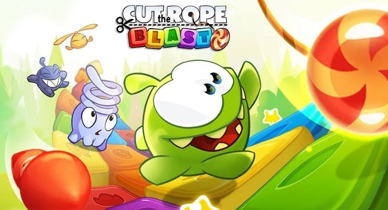 alt: Giao diện game Cut the Rope: BLAST với Om Nom và những viên kẹo đầy màu sắc