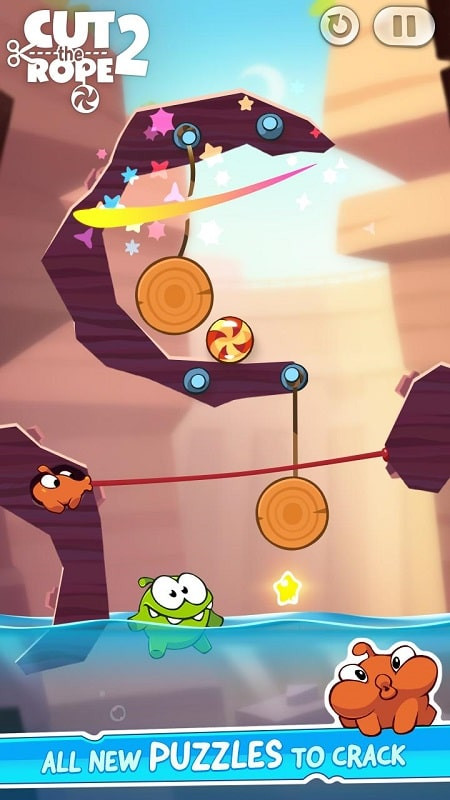 Om Nom đang thưởng thức kẹo trong Cut the Rope 2 MOD