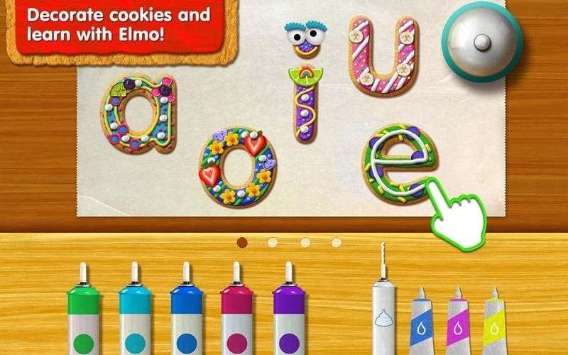 Child decorating cookies in Sesame Street Alphabet Kitchen